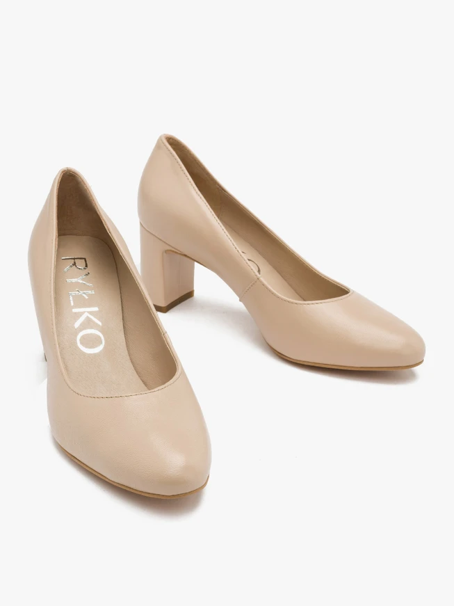 Beige pumps on a post