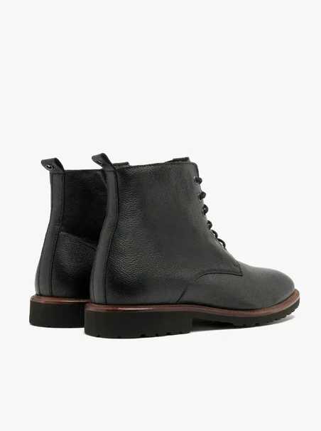 Black men’s boot with decorative welt