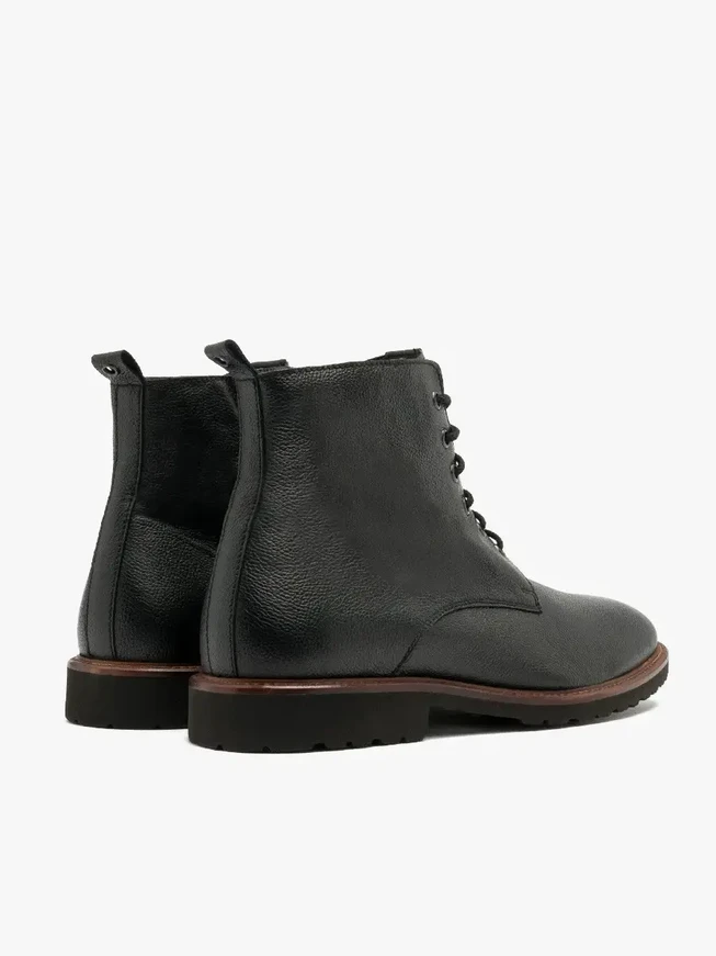 Black men’s boot with decorative welt