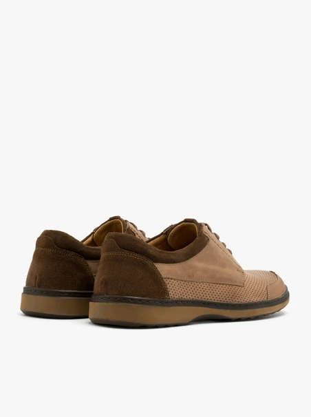 Brown shoes with decorative perforation