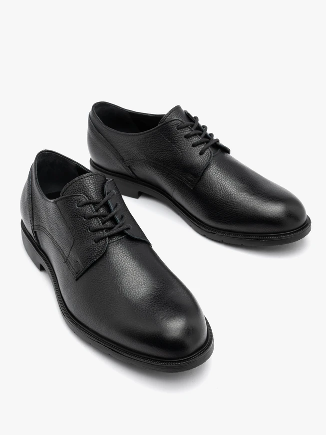 Black men's half shoe on a light bottom