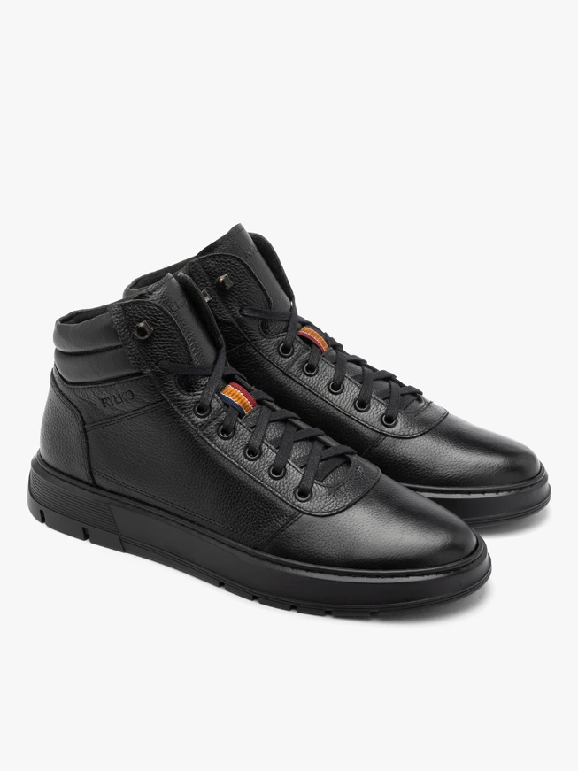 Black sporty men’s boots on a black sole