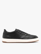 Schwarze halbe Sportschuhe mit weißem und beigem Untergrund