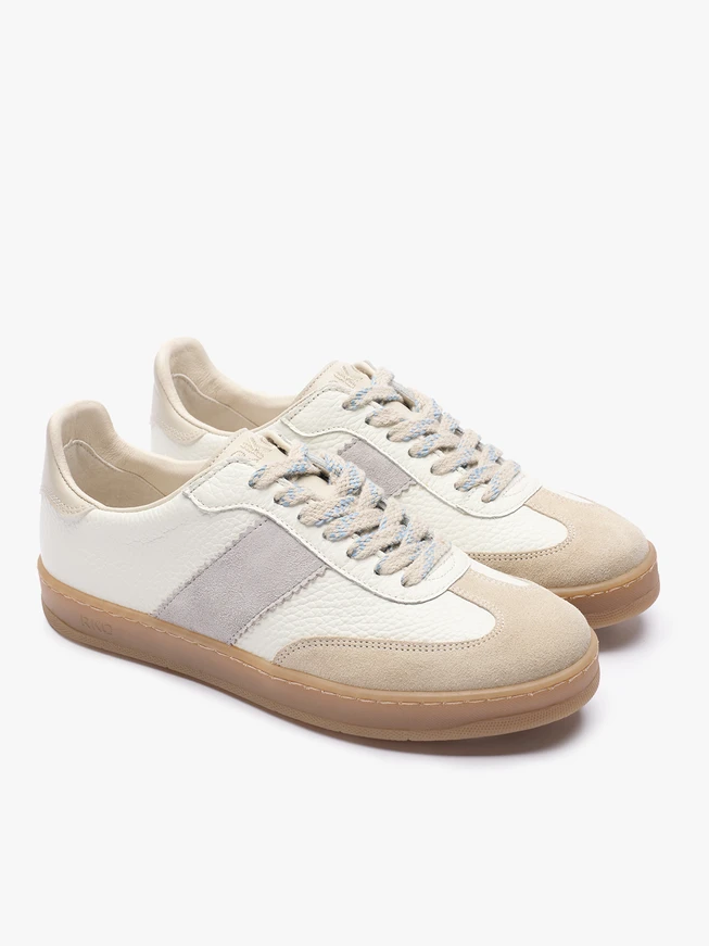 Cremefarbene Turnschuhe mit grauem Streifen