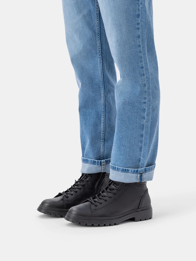 Black men’s boots with decorative stitching