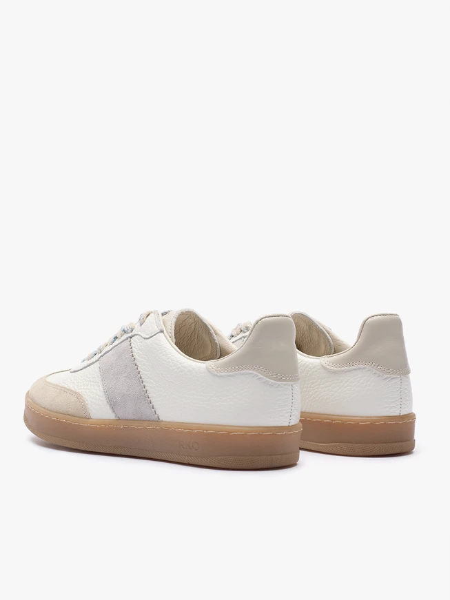 Cremefarbene Turnschuhe mit grauem Riemen