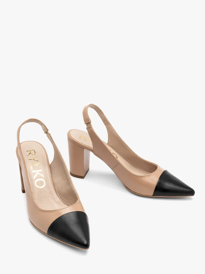 Beige pumps with black toe cap