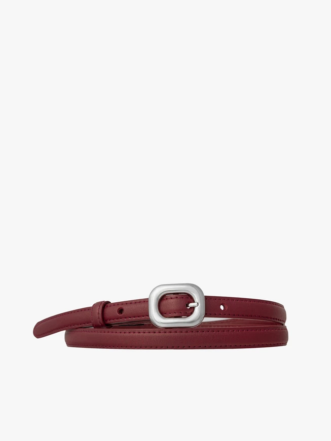 Burgundy women’s leather belt with a silver buckle