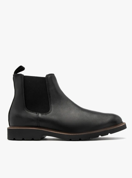 Black men’s Chelsea boots with brown sole edge