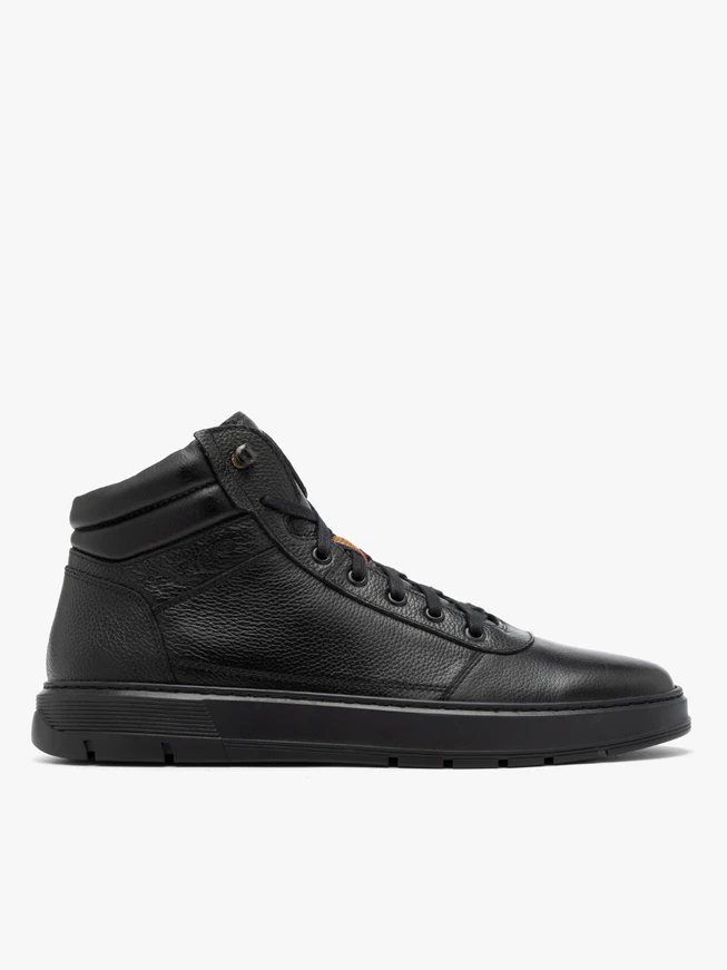 Black sporty men’s boots on a black sole
