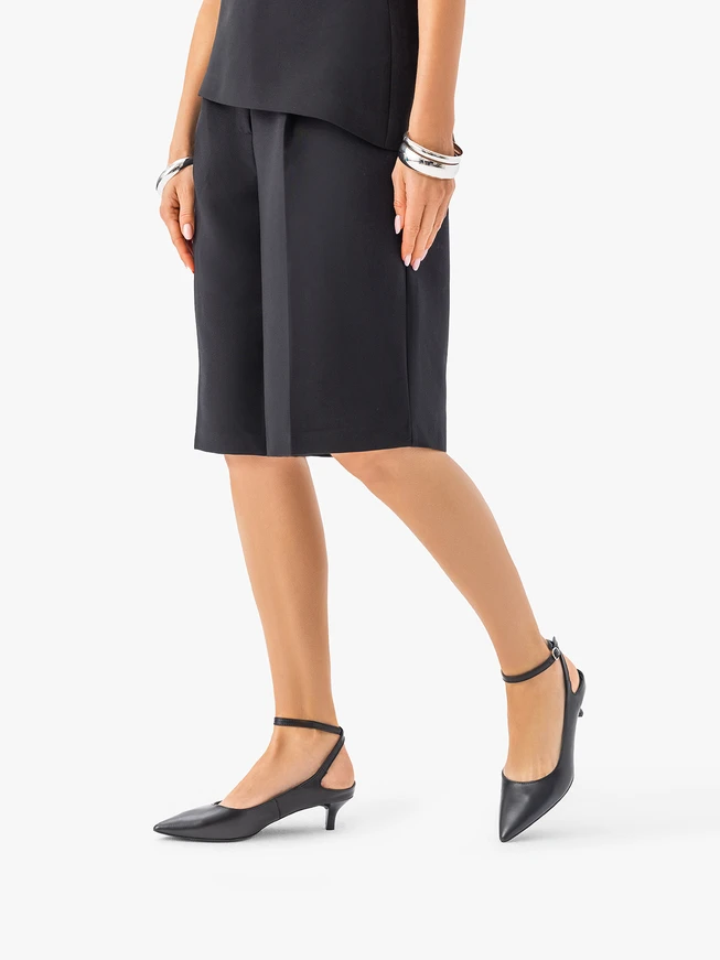 Schwarze Entenschwanz-Pumps