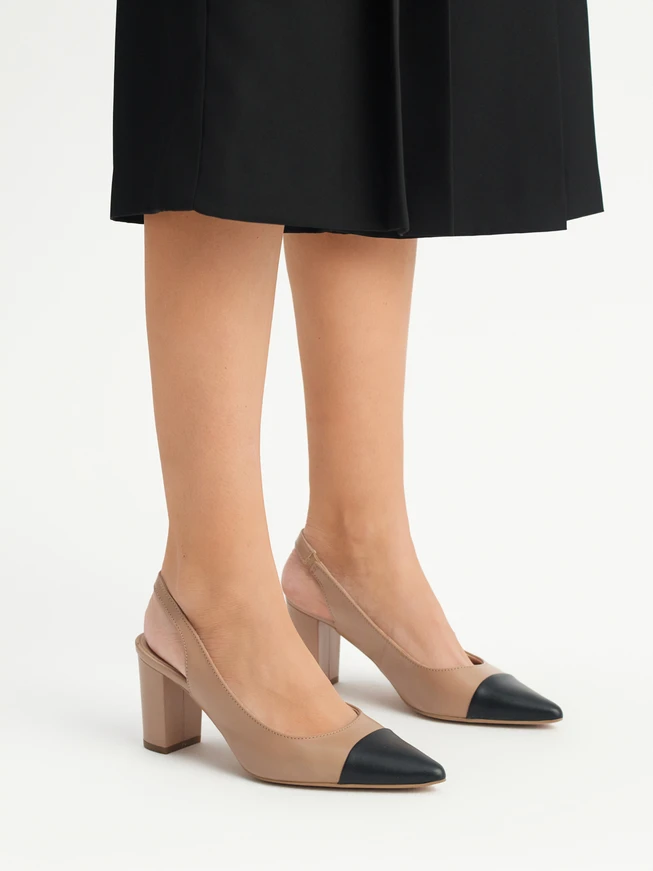 Beige pumps with black toe cap