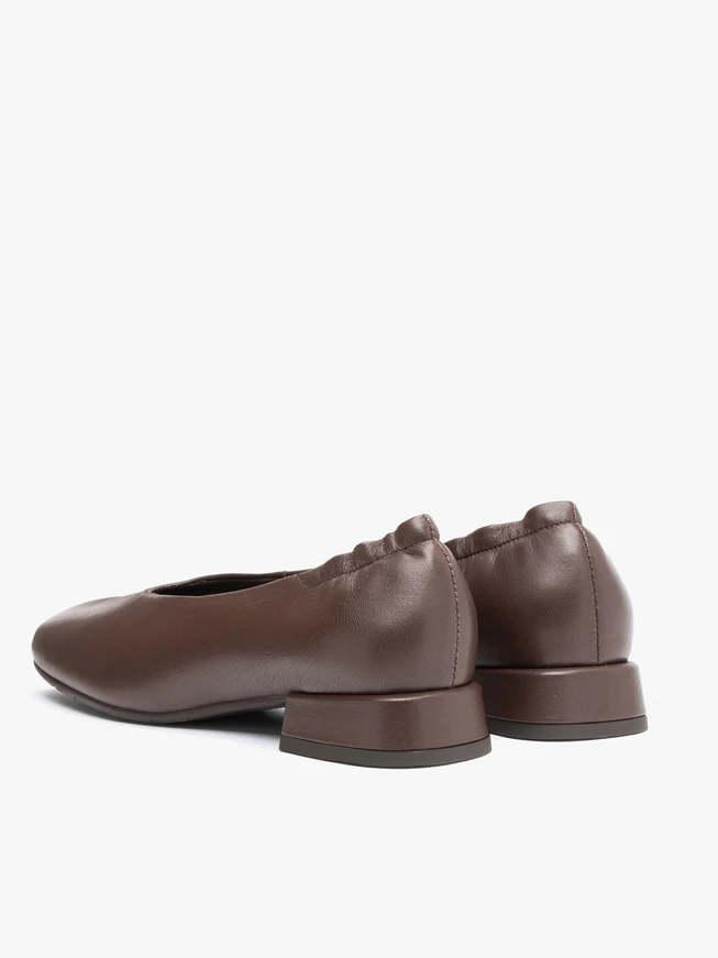 Brown pumps on a block with a square nose