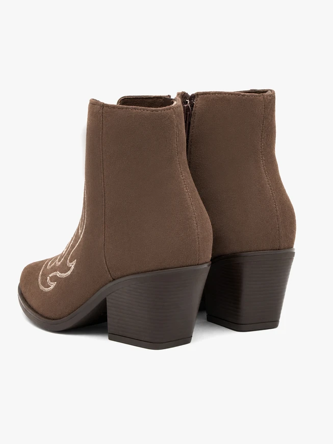 Brown cowboy-style ankle boots with stitching