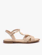 Cremefarbene flache Sandalen mit Verzierung