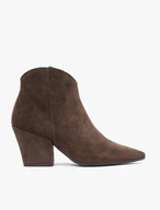 Dark brown cowboy boots on a pole