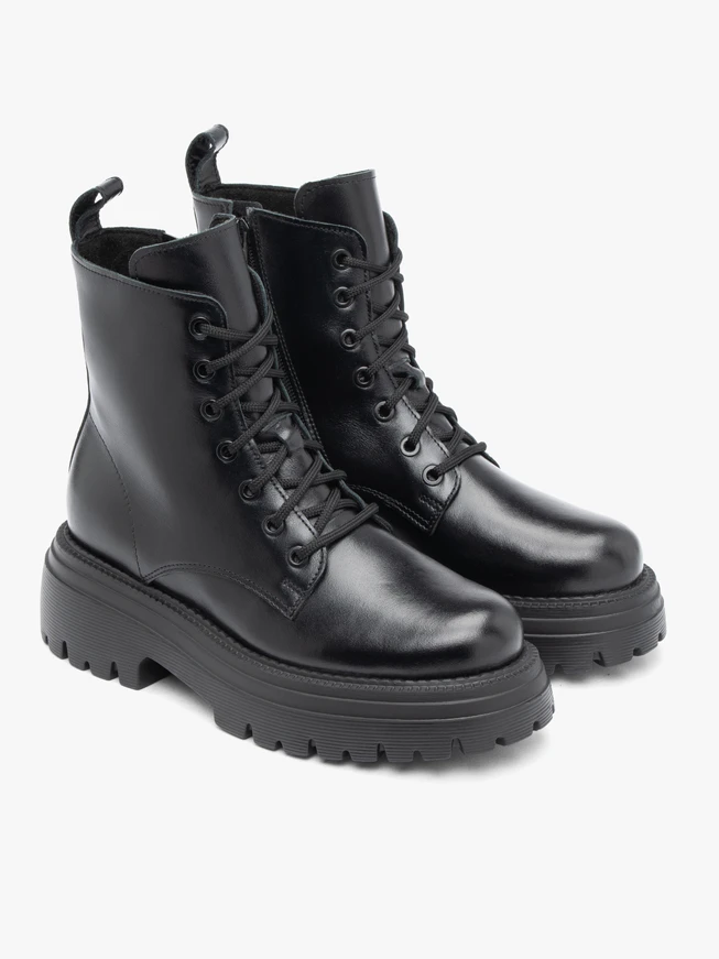 Black hiking boots with a thicker sole