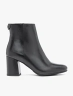 Black leather boots on a post