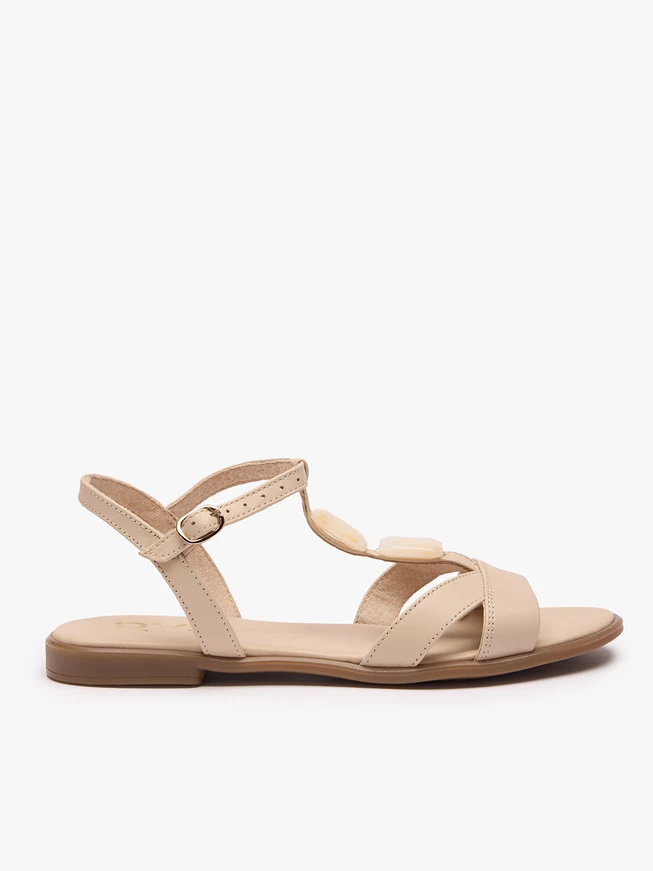 Cream sandals with a decorative element