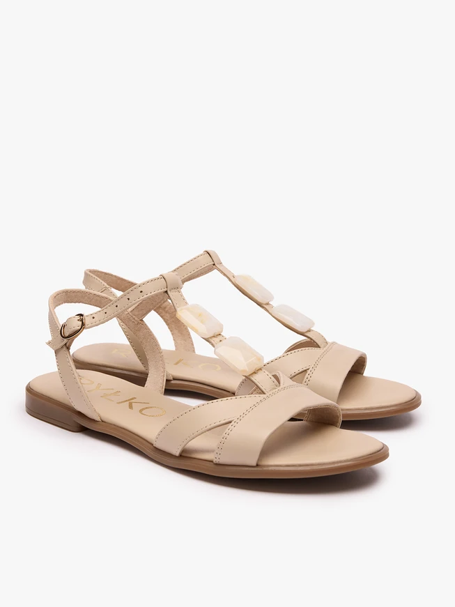 Cream sandals with a decorative element