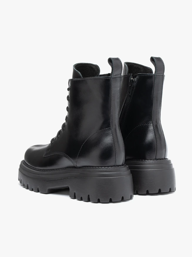 Black hiking boots with a thicker sole