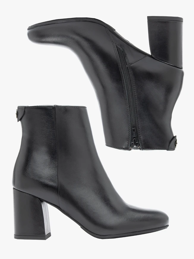 Black leather boots on a post