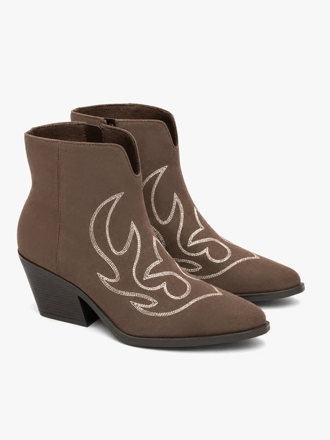 Brown cowboy-style ankle boots with stitching