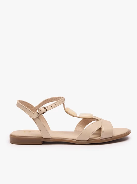 Cremefarbene flache Sandalen mit Verzierung