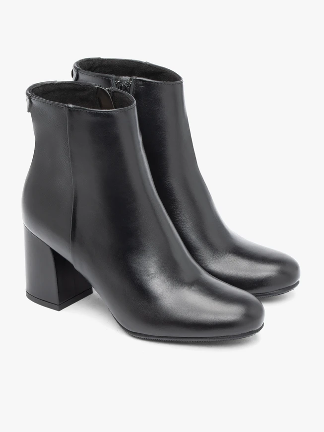 Black leather boots on a post