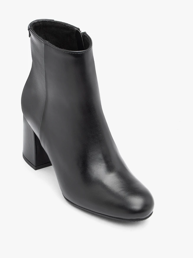 Black leather boots on a post