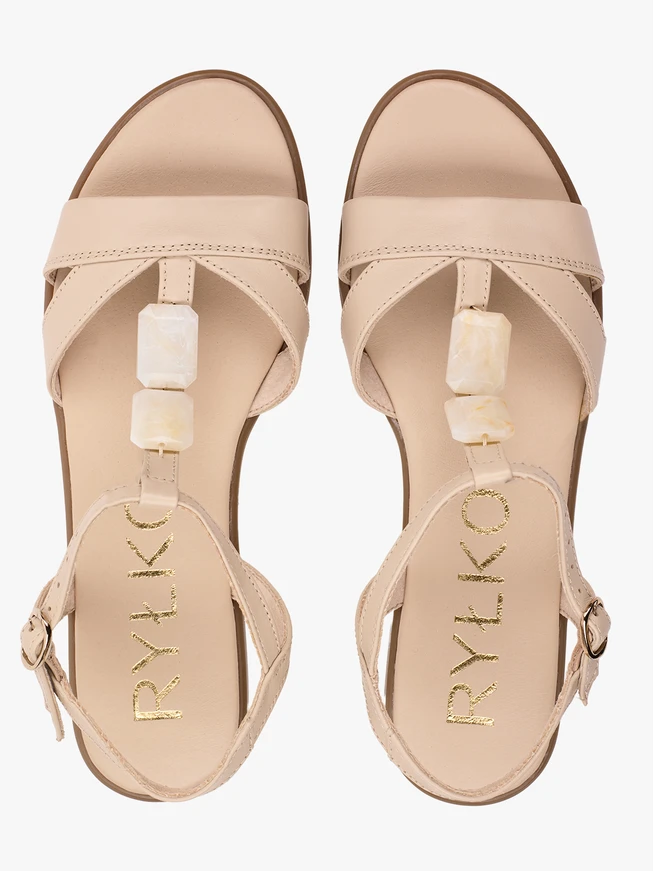Cream sandals with a decorative element