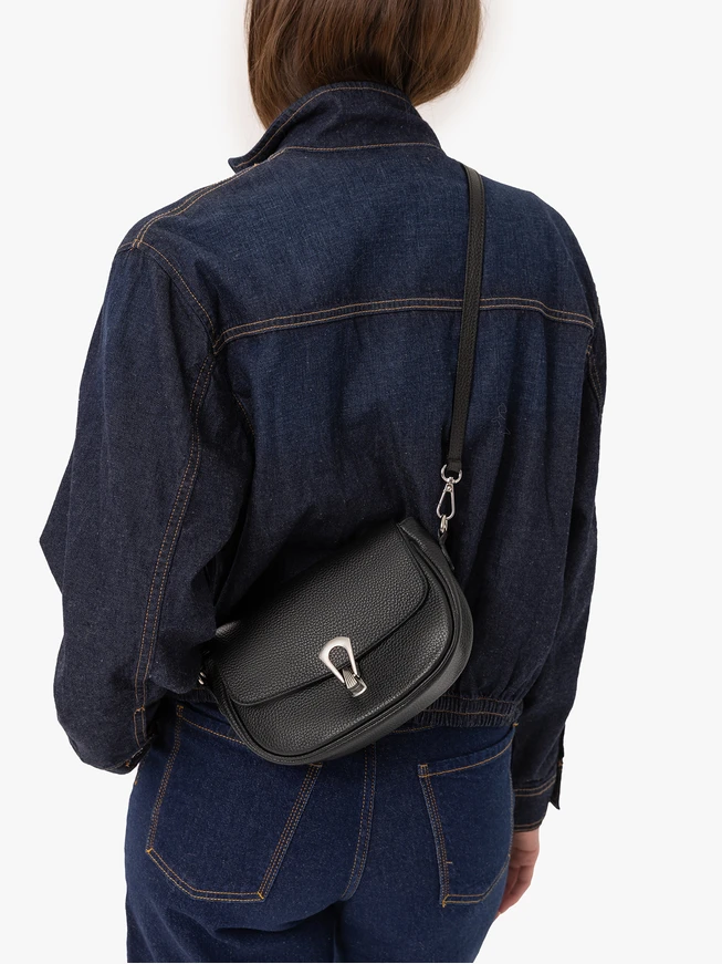 Black handbag with decorative buckle