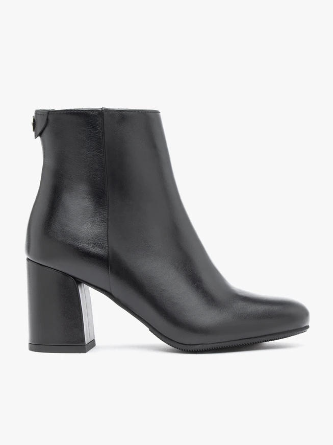 Black leather boots on a post