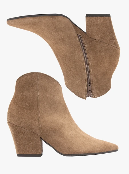 Beige cowboy boots on a pole