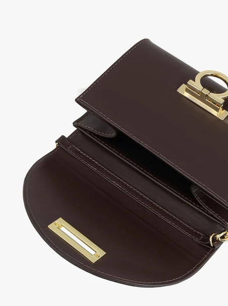 Brown clutch bag with a chain