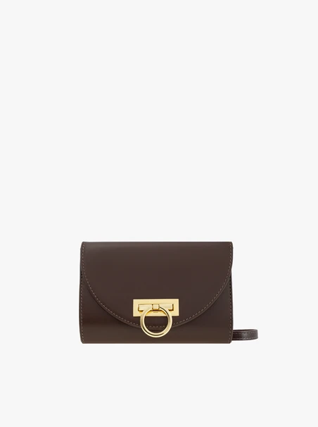 Brown clutch bag with a chain
